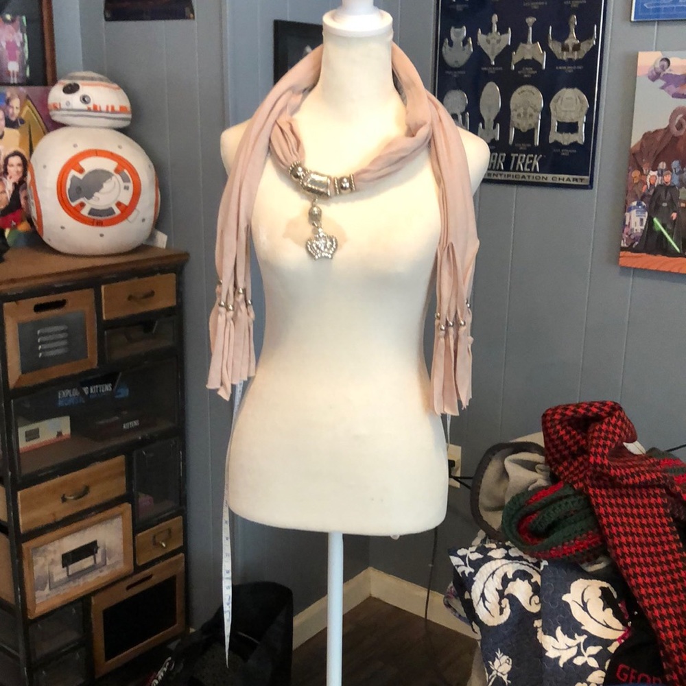 Tan scarf with silver beads and silver crown in middle